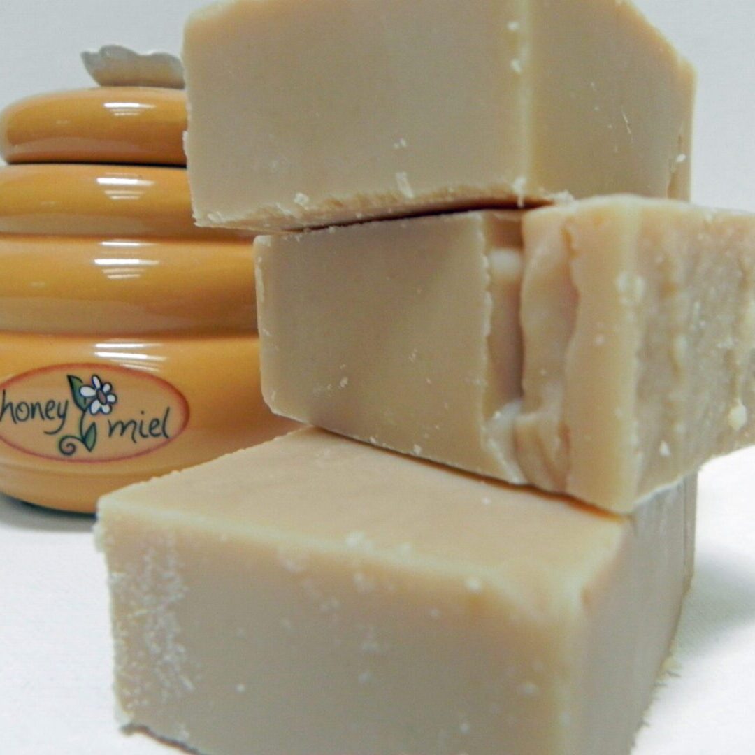 Handmade soap beside honey container